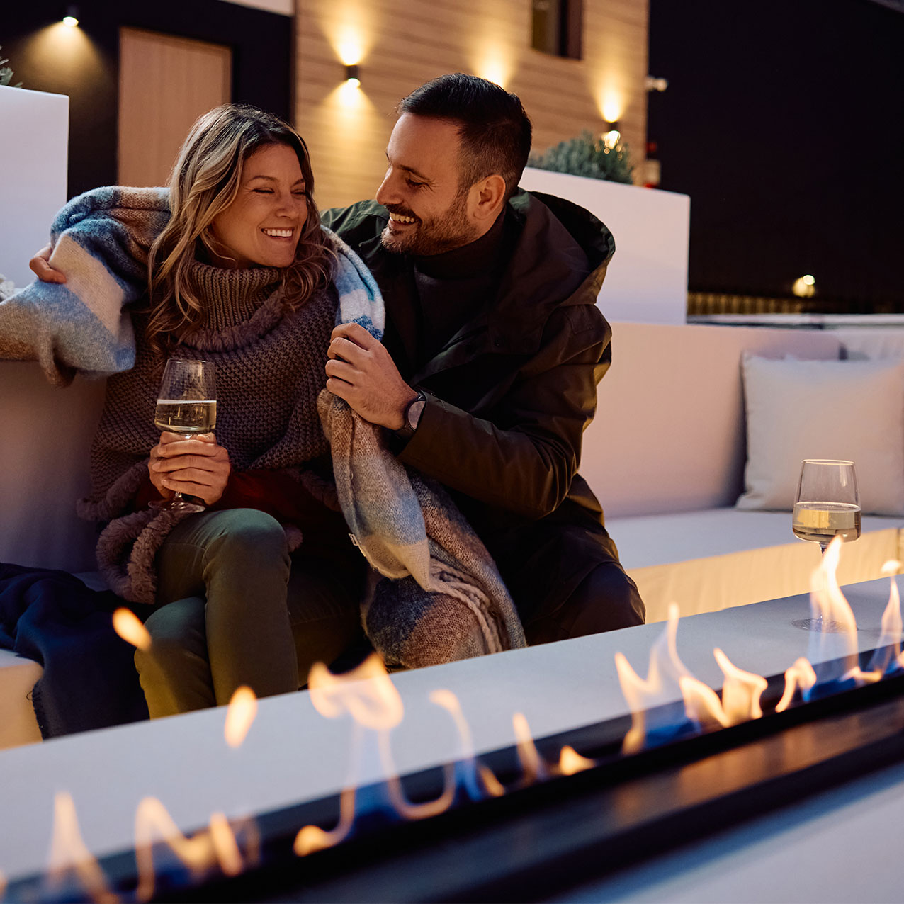 Couple Outdoors Enjoying Gas Fireplace